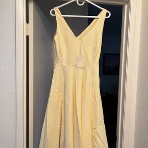 Aline yellow dress with white design. Size medium - a seersucker material